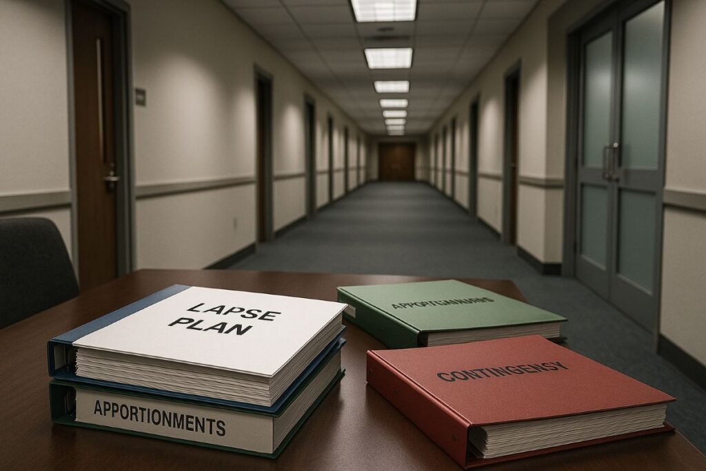 Russ Vought shutdown — neutral OMB-style office corridor with briefing binders and “lapse plan” folders on a table